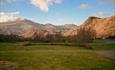 Cae Du field with backdrop of Snowdonia National Park mountains