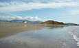 Wendon Holidays seen from the beach, with a glorious backdrop of mountains and the Hill forte.