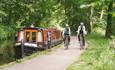 Two cyclists exploring Llangollen canal via bike