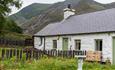 traditional cottage in Snowdonia with mountains in the background