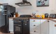 The kitchen at Gors-lwyd Cottage with smeg fridge freezer and Rangemaster cooker