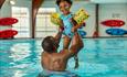 Image and father and daughter in a swimming pool
