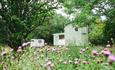 Snowdonia Shepherds' Huts in wildflower meadow, near Betws-y-Coed, North Wales