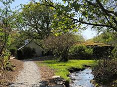 Pont Faen has been newly renovated and is tucked away in a secluded location with a stream to the front and private lake to the rear. Single storey an