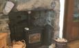 The cosy woodburner at Arallt Holiday Cottage on the Llŷn Peninsula