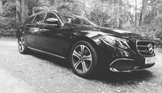 Black and White image of stunning Black E-Class Estate on a 19 plate.
