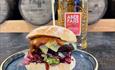 Image of Wagyu beef Burger and a Bottle of Aber Falls Whisky
