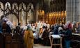 Bangor Cathedral during a recent service with congregation closest to camera and choir behind.
