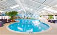 Large kidney shaped swimming pool with blue waters