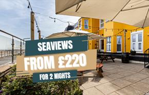 The Beaches Hotel Terraced area with the offer price from £220 for 2 nights overlaid on the top.