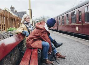 Couple waiting on train platform