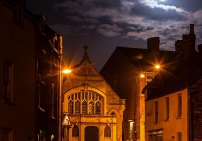 Malmesbury at night with a  full moon