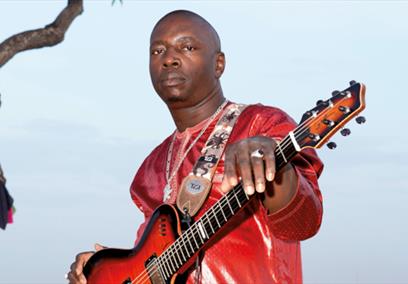 Vieux Farka Toure holding a guitar