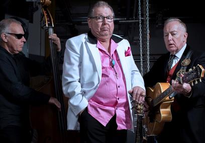 Three men holding string instruments
