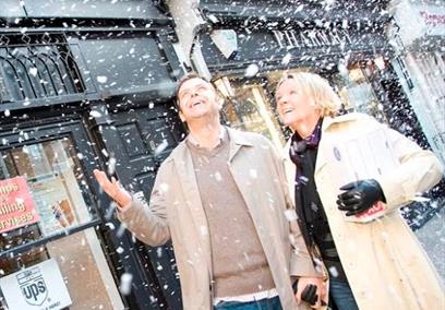 Couple in marlow high street with 'snow effect'.
