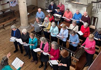 A choir singing in John Wesley's New Room