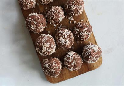 Chocolate truffles on a wooden board