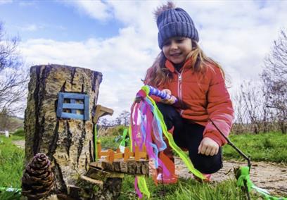 A young girl looking a fairy grove