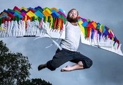 Man flying with quilted wings