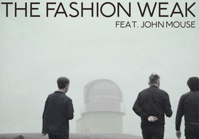 Three men walking towards a lighthouse in rain