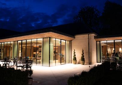 Exterior of the Walled Garden Restaurant at Lucknam Park by night