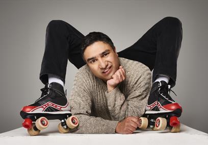 Nick Mohammed wearing roller skates