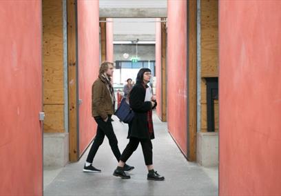 Two people exploring artists' studios at Spike Island, Bristol