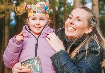 woman and young girl in woodland