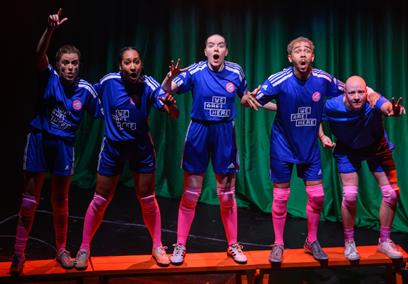 A group of peole wearing blue football kit