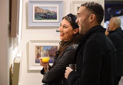Visitors appreciating the art at Contemporary Art Fairs Windsor