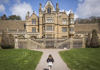 Girl playing in the garden at Easter at Tyntesfield, North Somerset by Rob Stothard