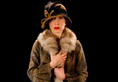 Woman in fur coat and hat costume for the show A Room of One's Own