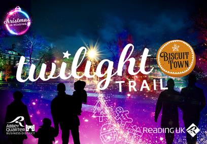 People looking at and walking amongst colourful lights