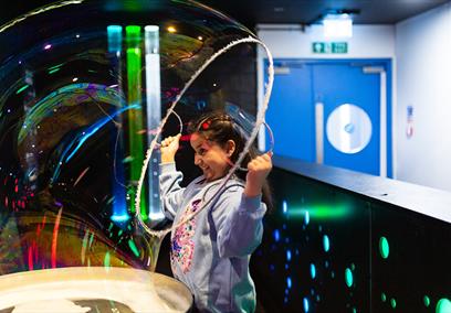 Girl playing with bubbles