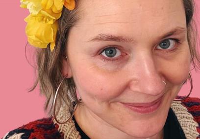 A lady wearing a flower headdress