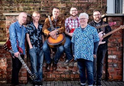 The Fun Lovin' Crime Writers band, posing with their instruments.