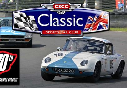 Classic sports cars driving around a racetrack