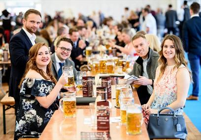 Group enjoying beer at Ascot Racecourse: Autumn Racing Weekend & Ascot Beer Festival