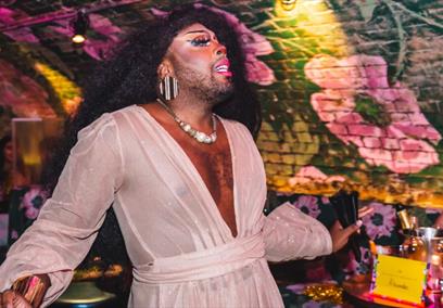 A drag queen serving