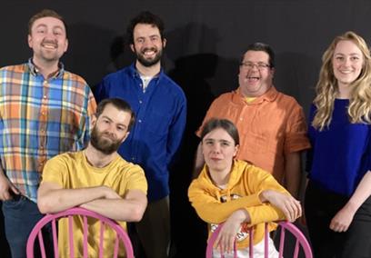 The cast members of GÄMEZ smiling.