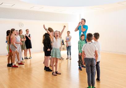 A group of children in a hall