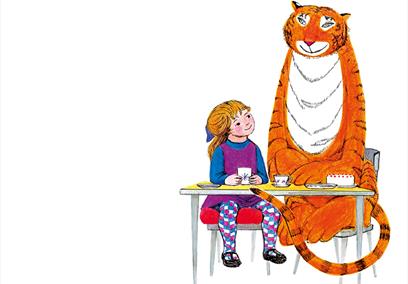 Illustration of a young girl and a tiger sat at a table having tea