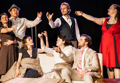 A group of actors performing on stage