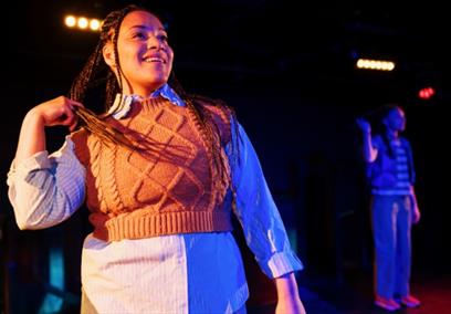 Woman smiling on stage