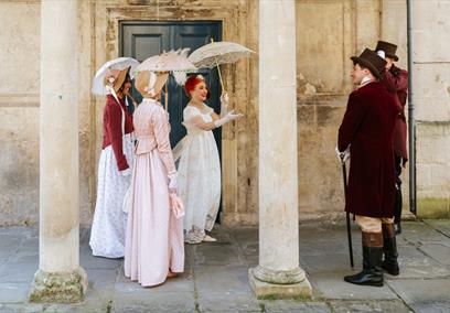 A group of people wearing Regency costume