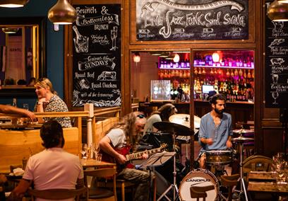 A band of musicians performing in the restaurant at Green Park Brasserie, Bath