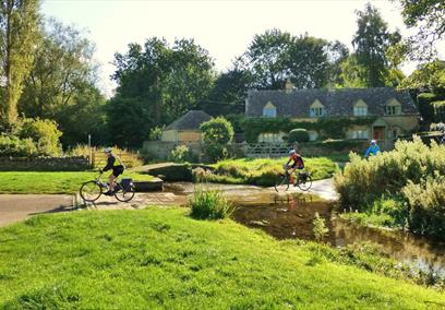 Bainton Bikes - cyclists crossing the Slaughters ford