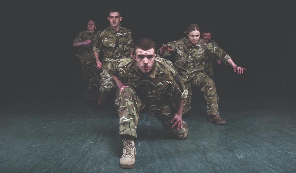 Five Soldiers looking directly at the camera