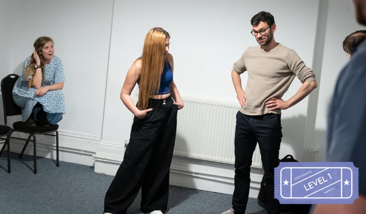 An improv theatre group practising