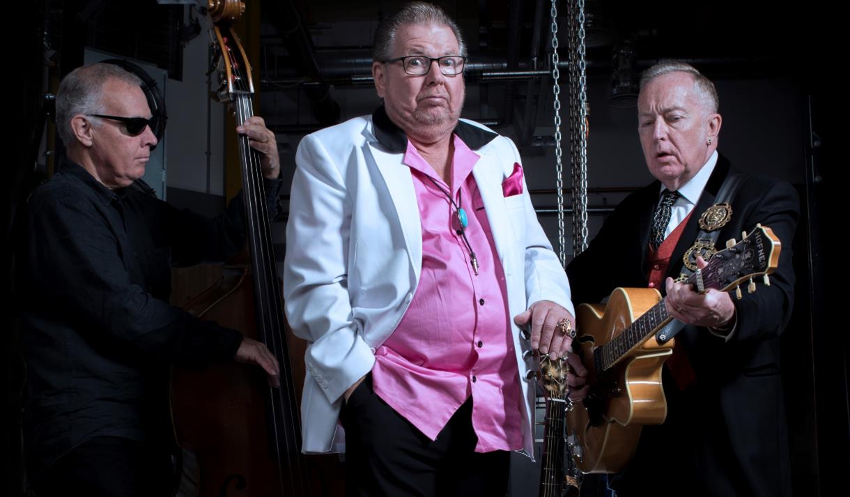 Three men holding string instruments